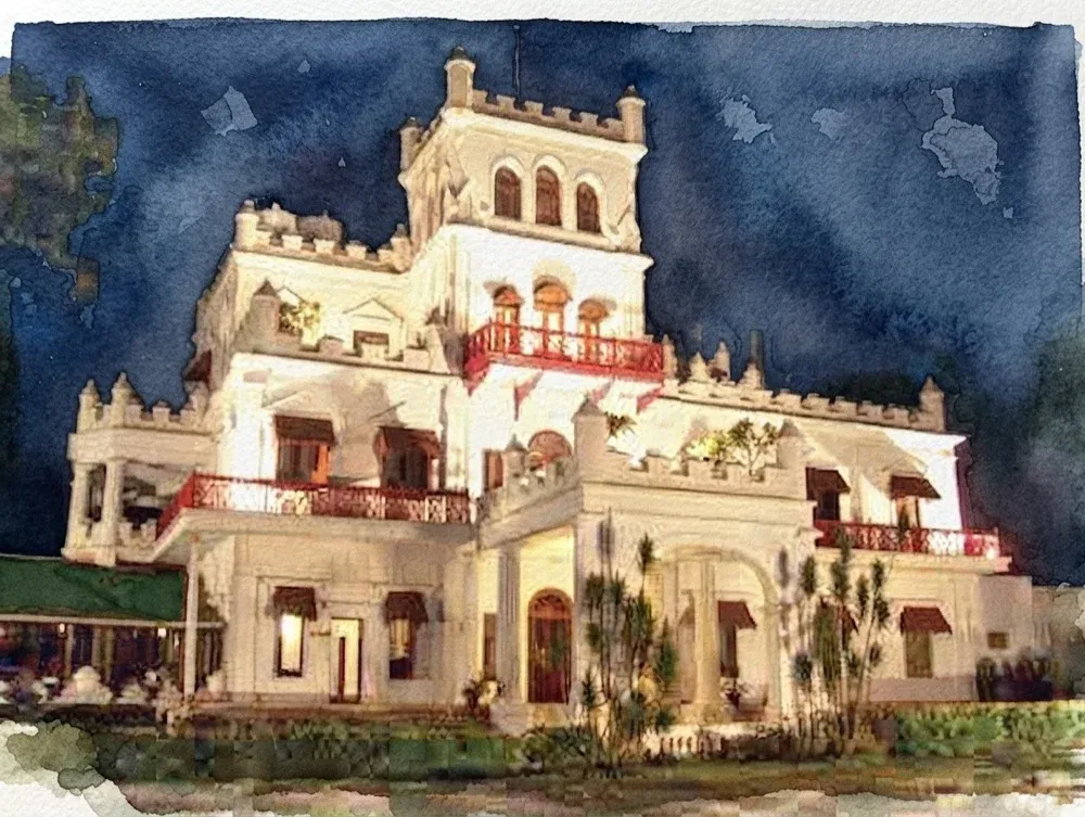 Watercolor illustration of Jayamahal Palace Hotel lit up at night